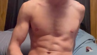 Teen guy jerking his cock on his bed