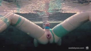 Axel Abysse fists his cunt by the pool