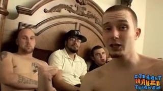 Muscular bald dude lays on the bed and pulls on his penis